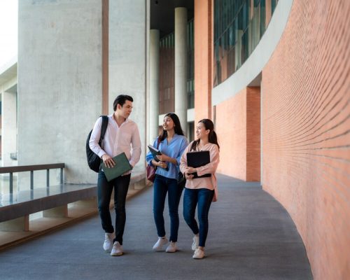 [freepicdownloader.com]-asian-three-students-are-walking-talking-together-university-hall-break-university-large